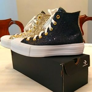 Converse glitter navy/gold high top sneakers.